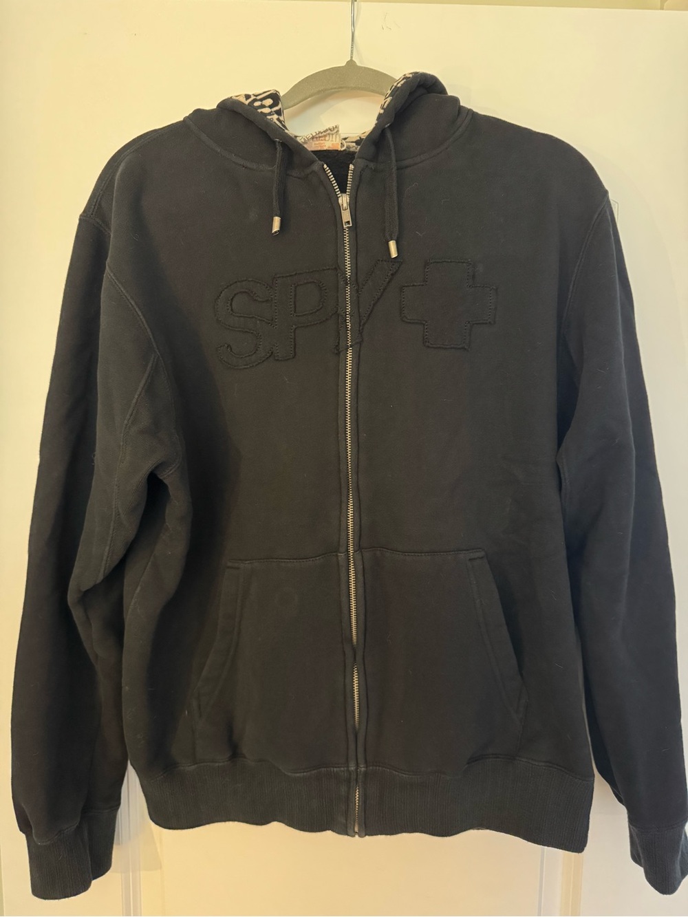 SPY Black Hoodie with White Graphic Lining and Orange Tag